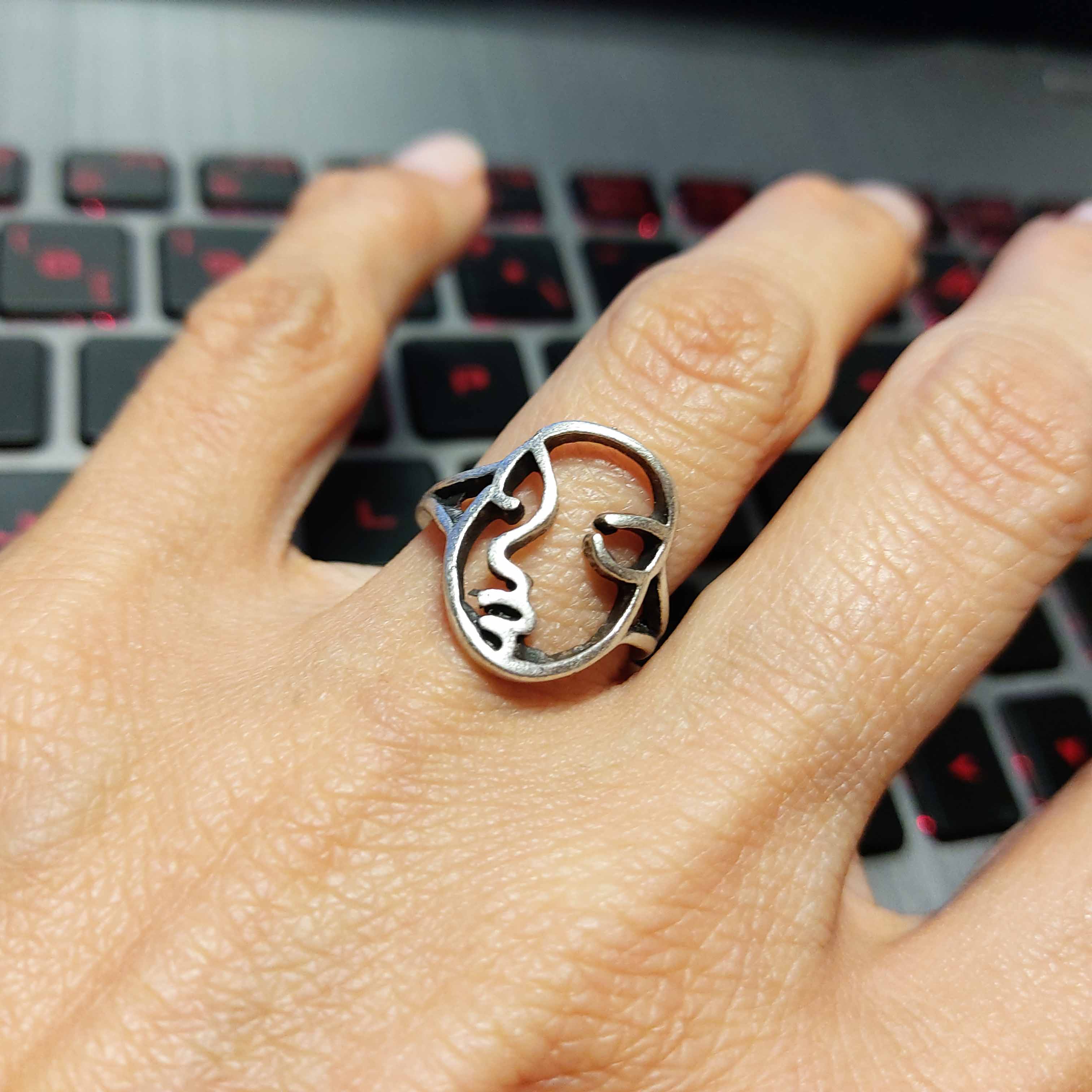 Silver abstract face ring, modern mask sculptural statement piece