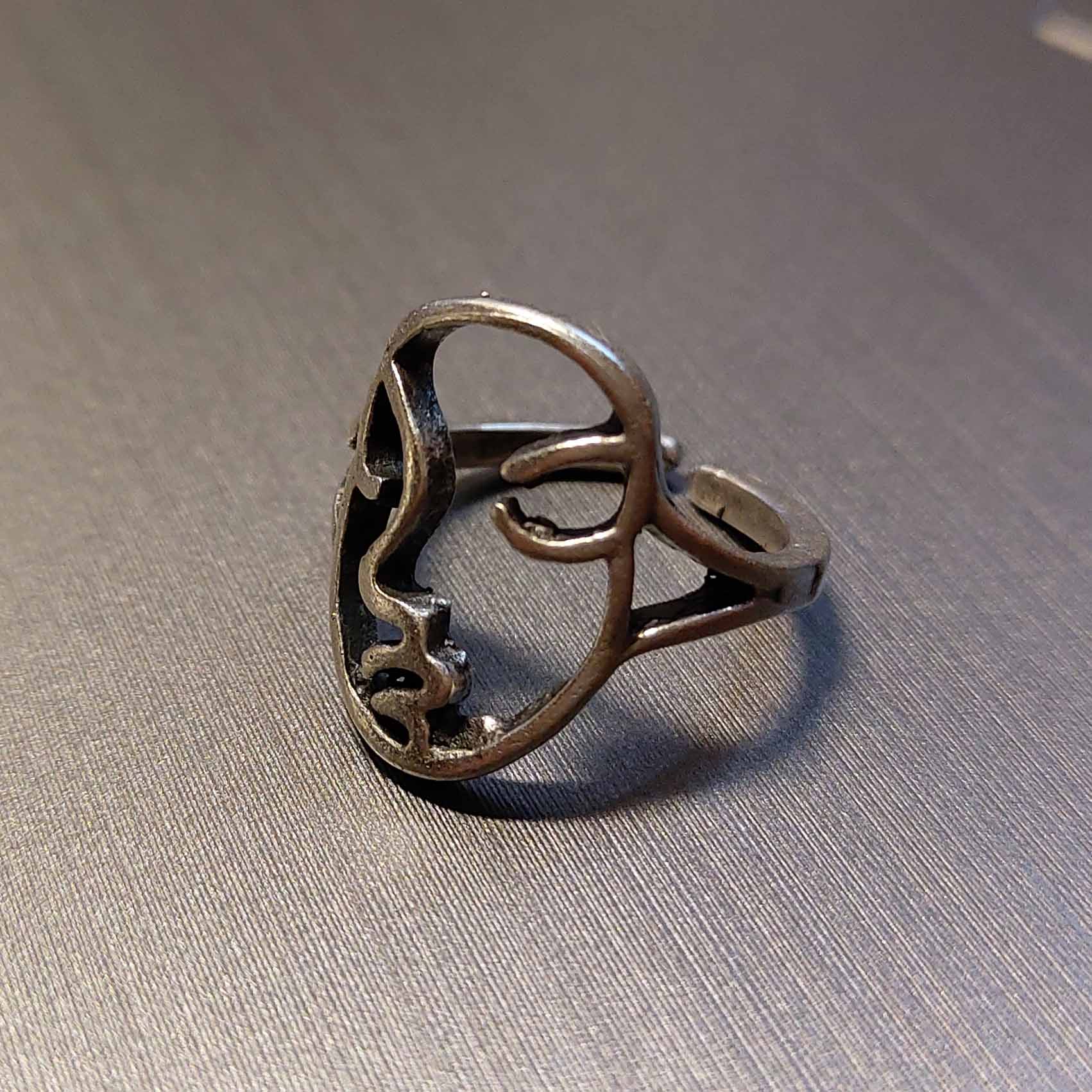Silver abstract face ring, modern mask sculptural statement piece