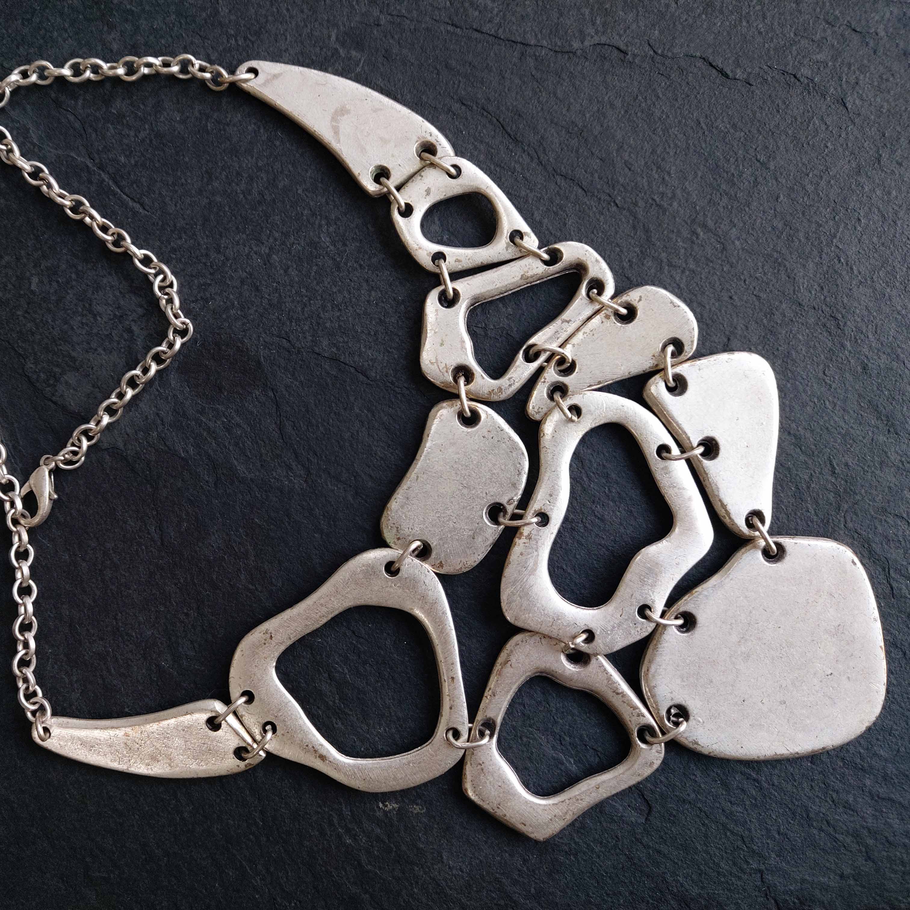 Silver brutalist mosaic bib necklace, organic geometric statement jewellery