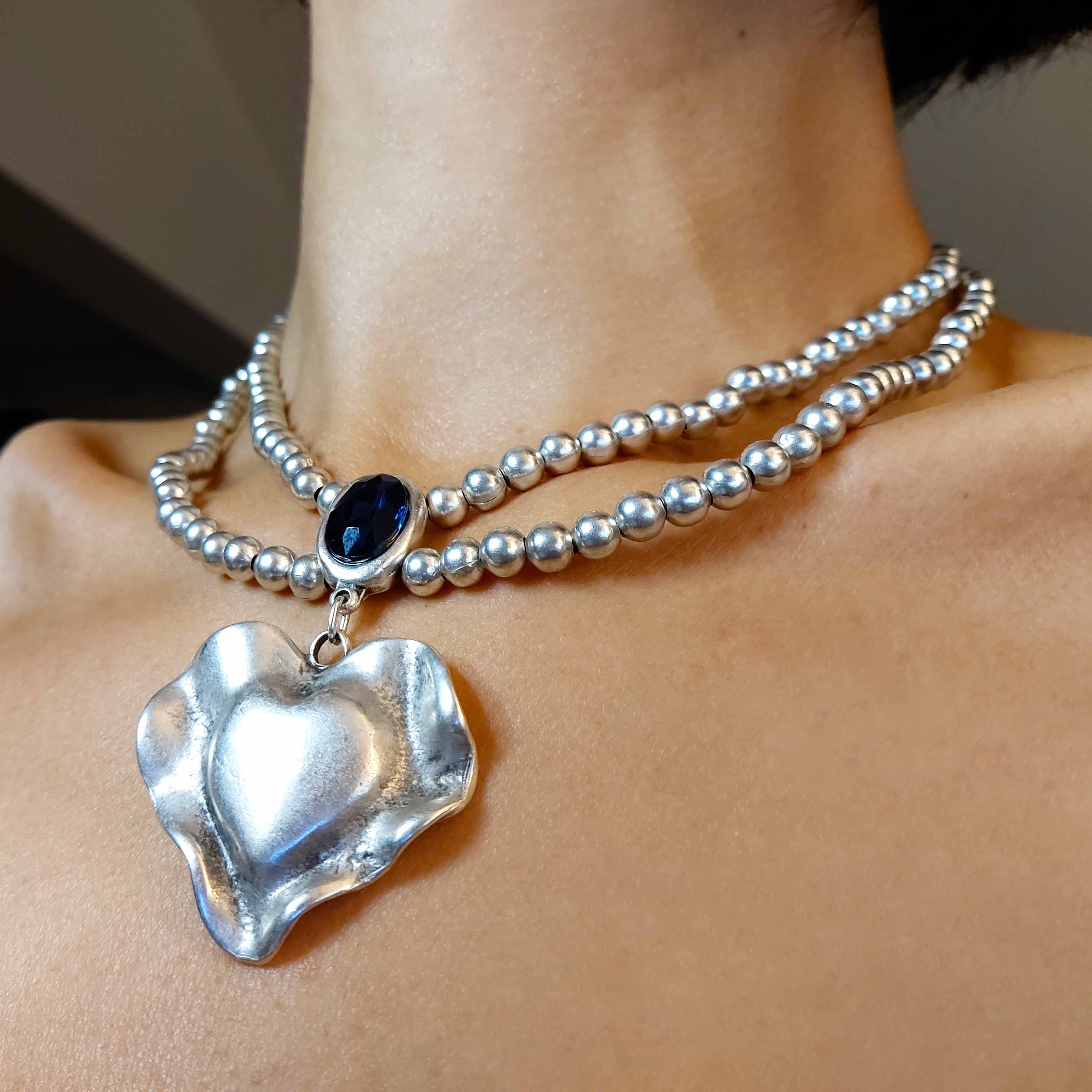 Silver molten heart pendant necklace, double strand bead chain with blue stone