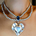 Silver molten heart pendant necklace, double strand bead chain with blue stone