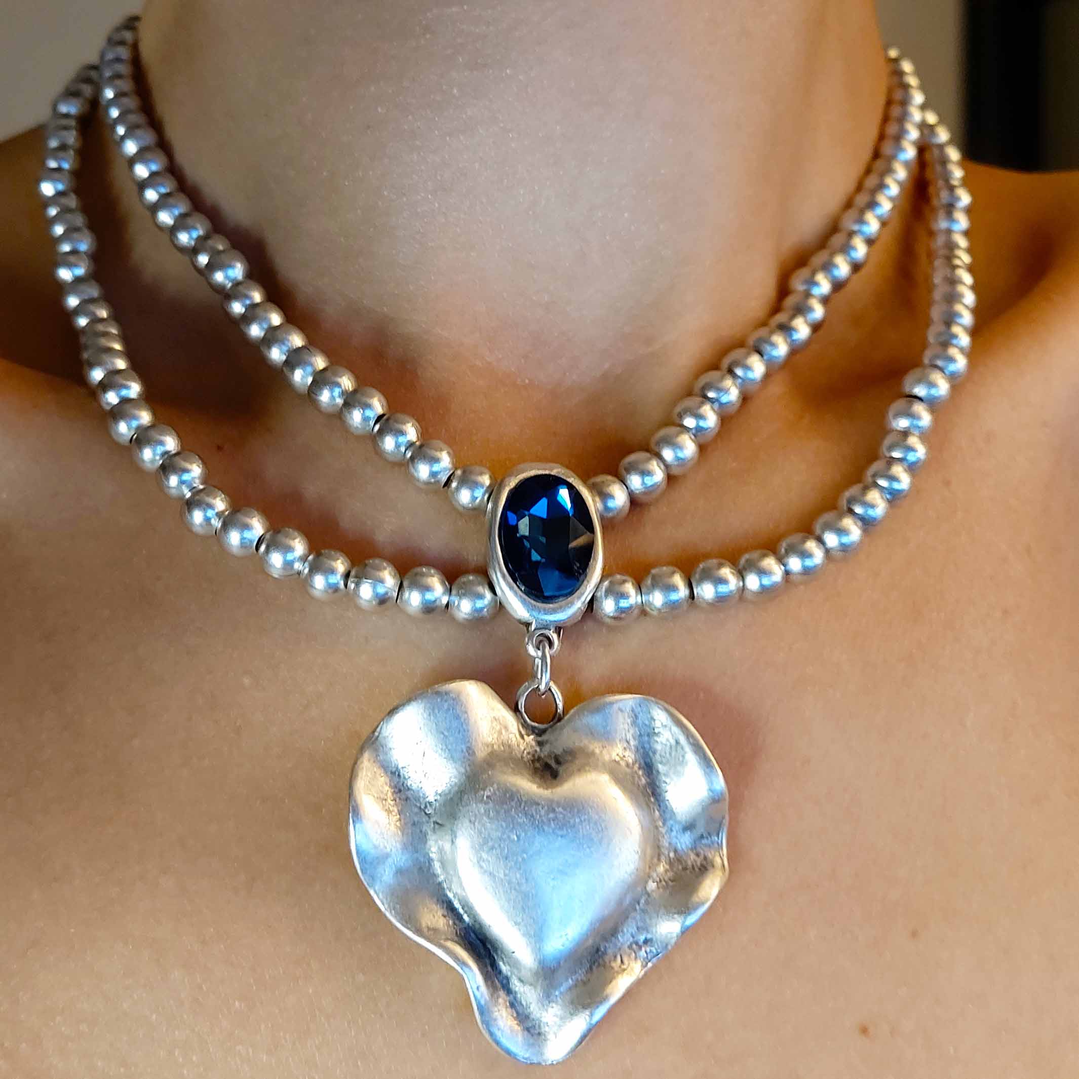 Silver molten heart pendant necklace, double strand bead chain with blue stone