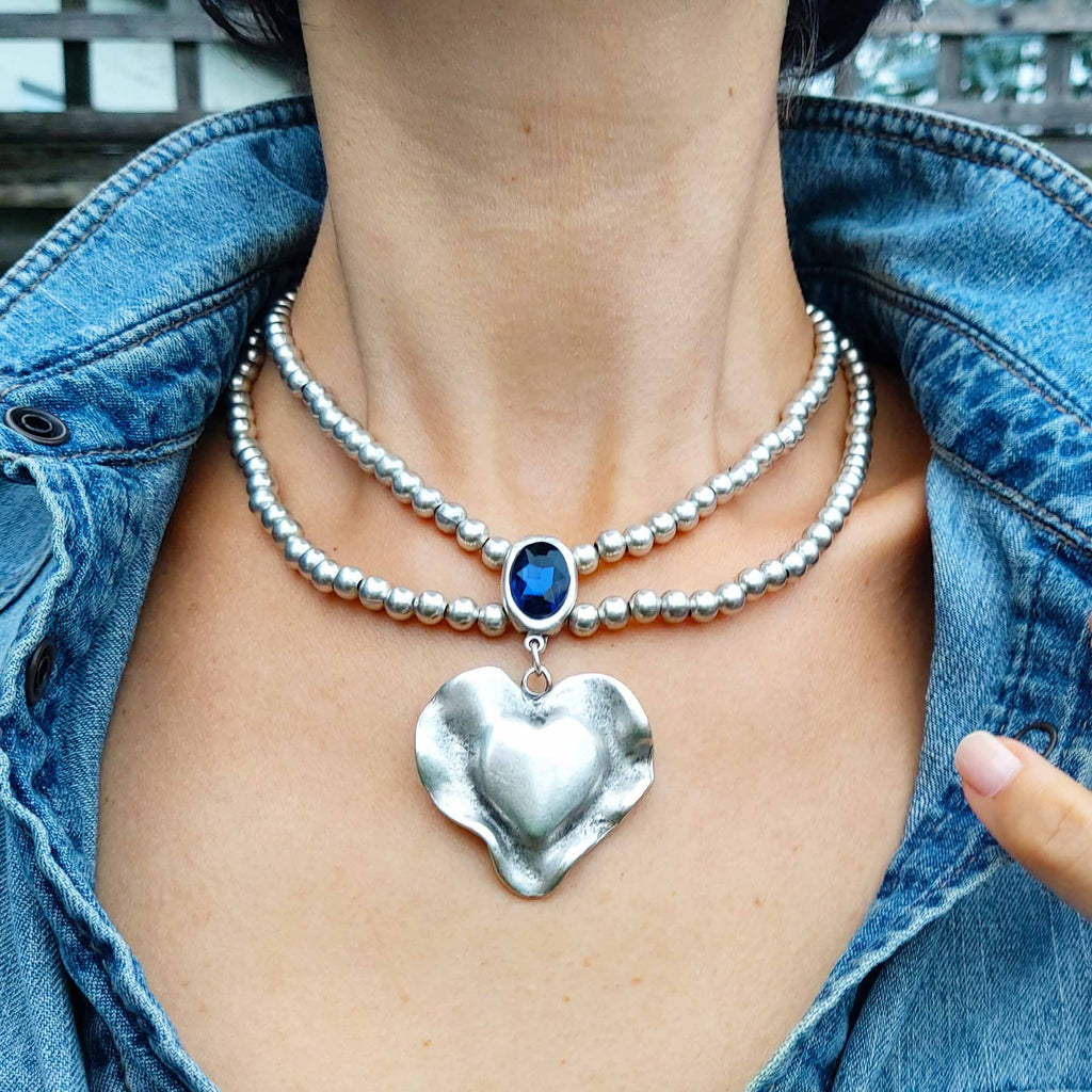 Silver molten heart pendant necklace, double strand bead chain with blue stone