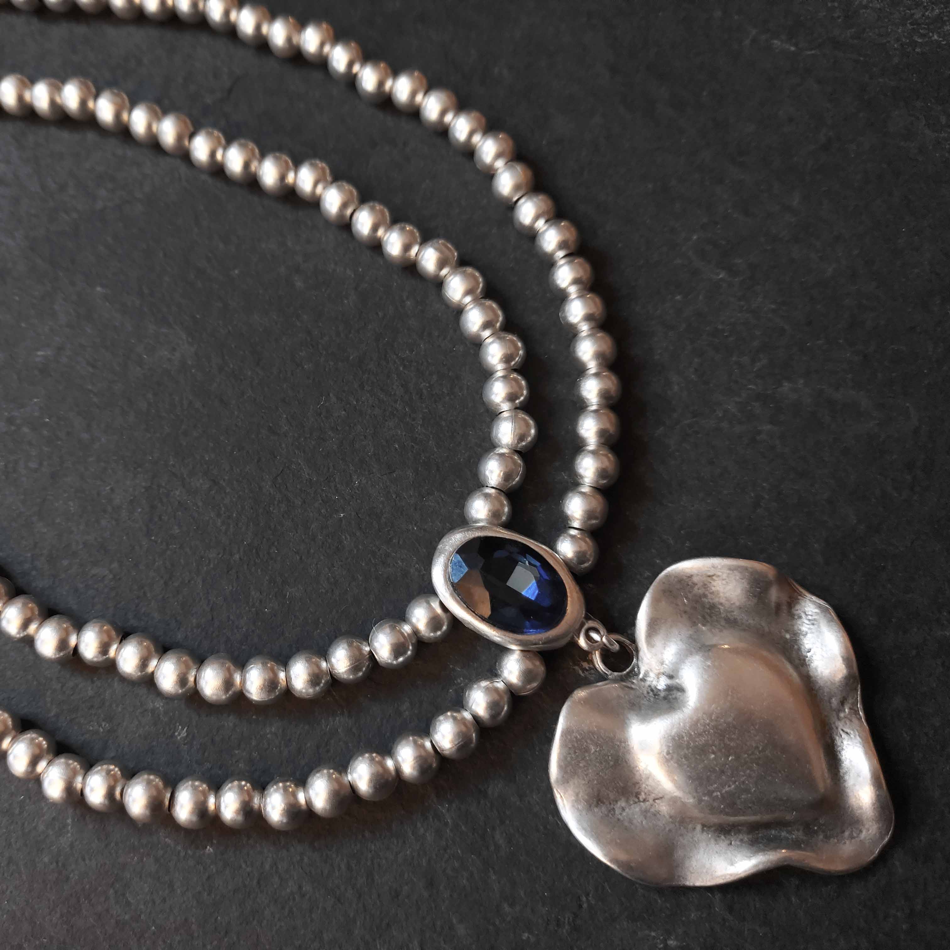 Silver molten heart pendant necklace, double strand bead chain with blue stone