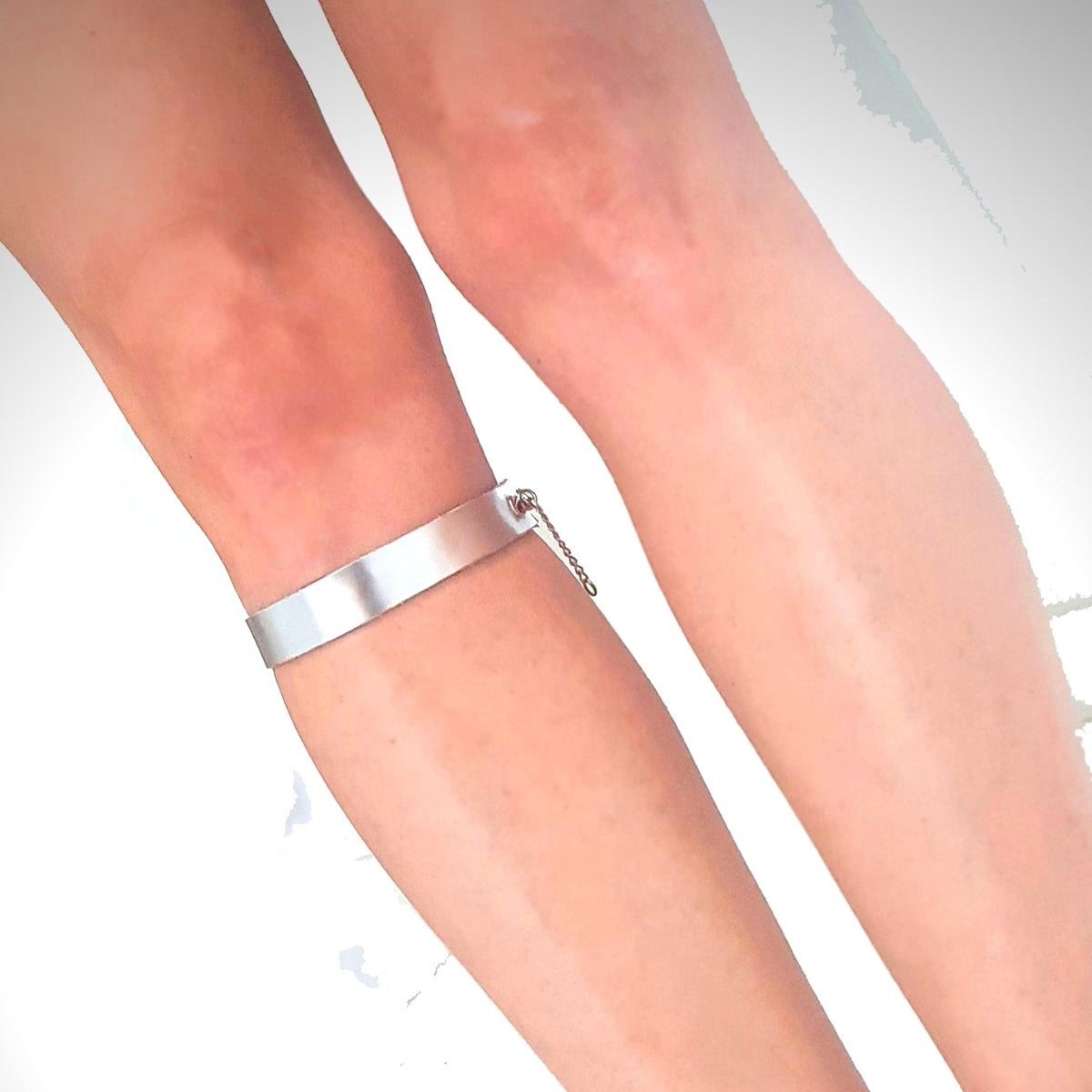 Silver leather leg chain with feather charm, summer body jewellery