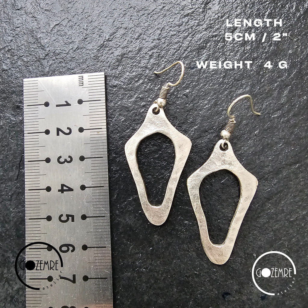 Brutalist silver earrings, anatomical sculptural drop statement