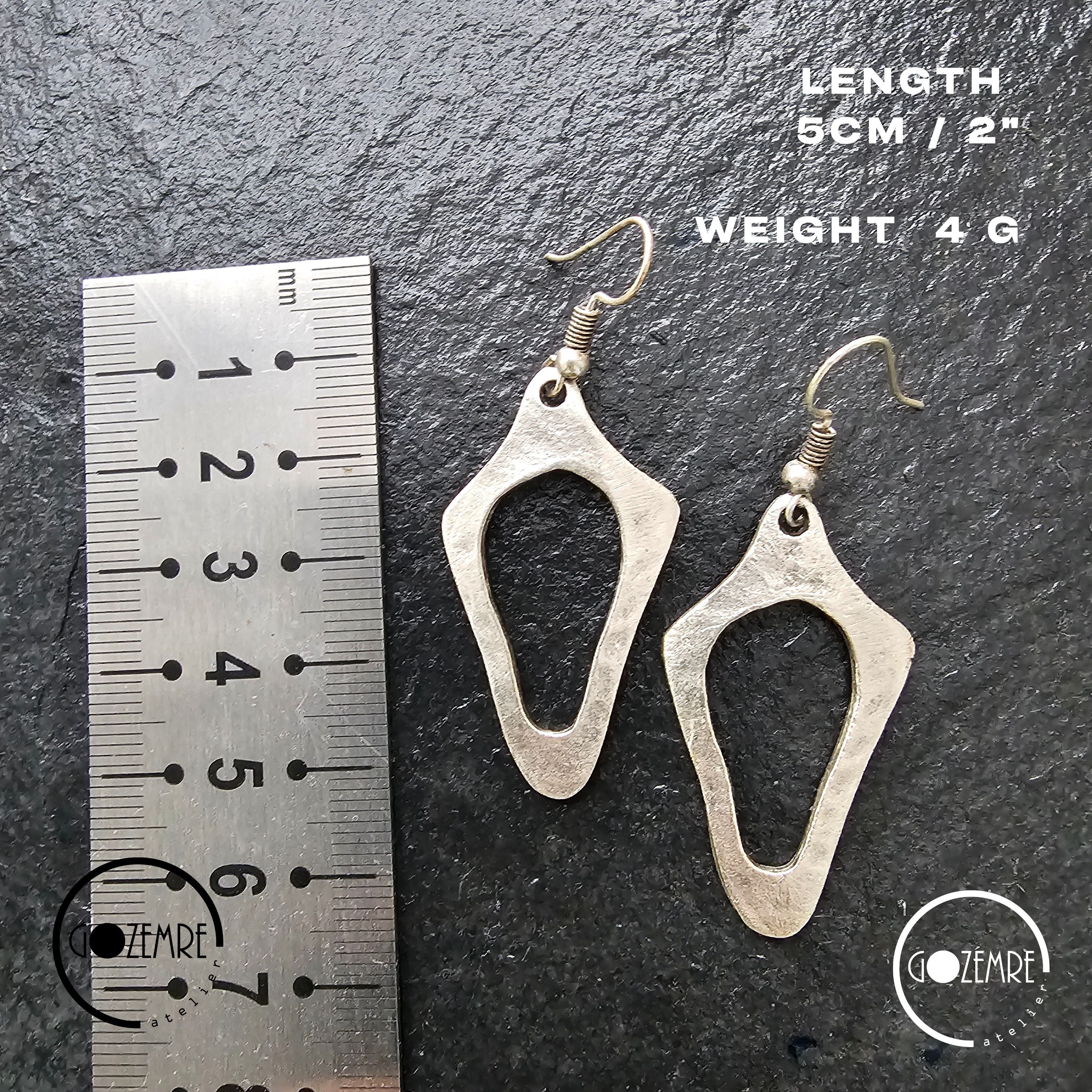 Brutalist silver earrings, anatomical sculptural drop statement