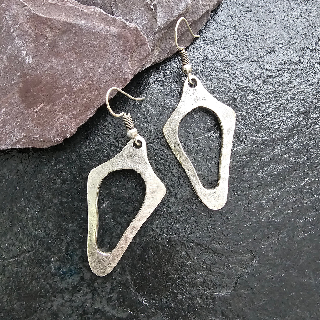 Brutalist silver earrings, anatomical sculptural drop statement