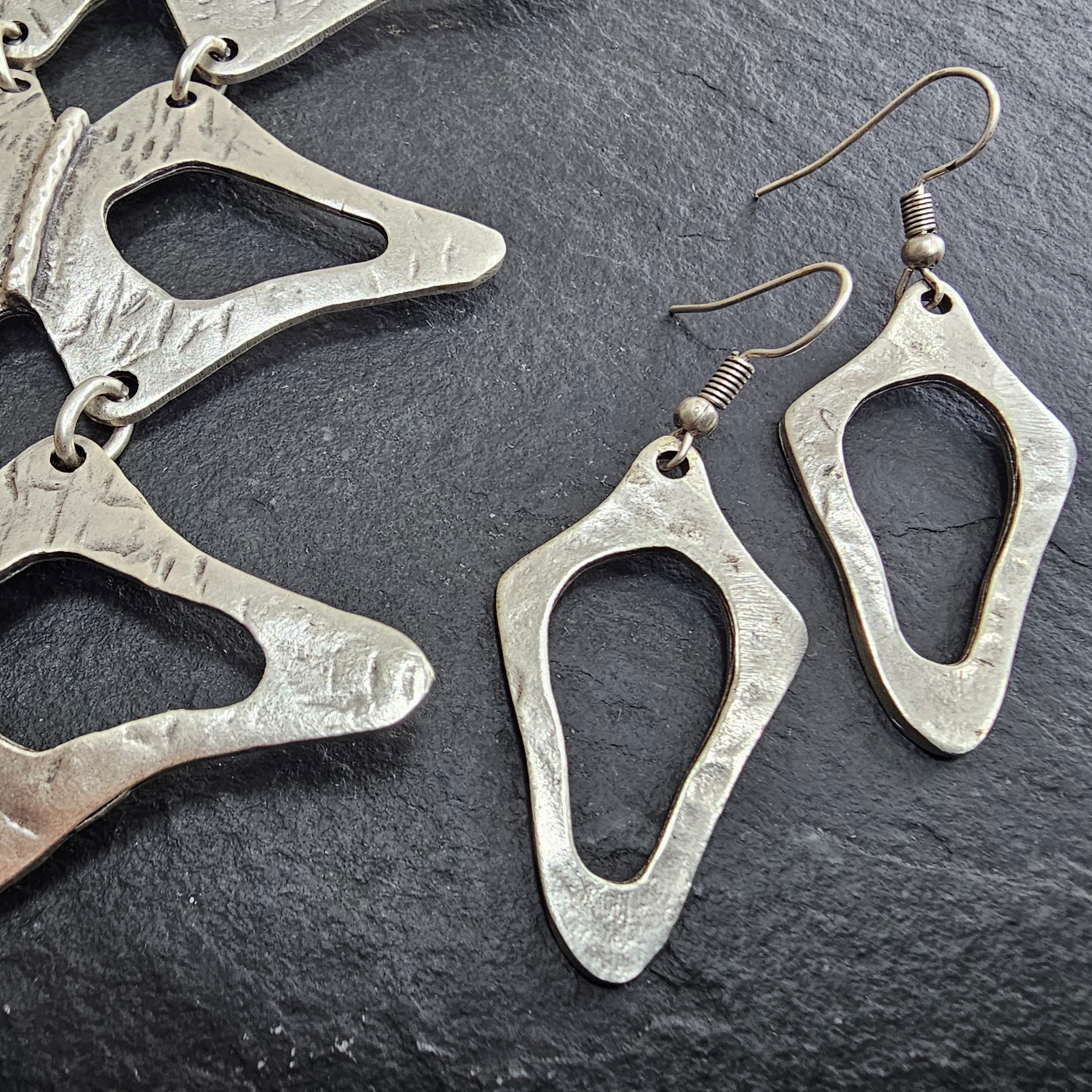 Brutalist silver earrings, anatomical sculptural drop statement