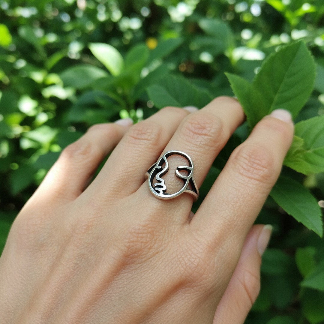 Silver abstract face ring, modern mask sculptural statement piece