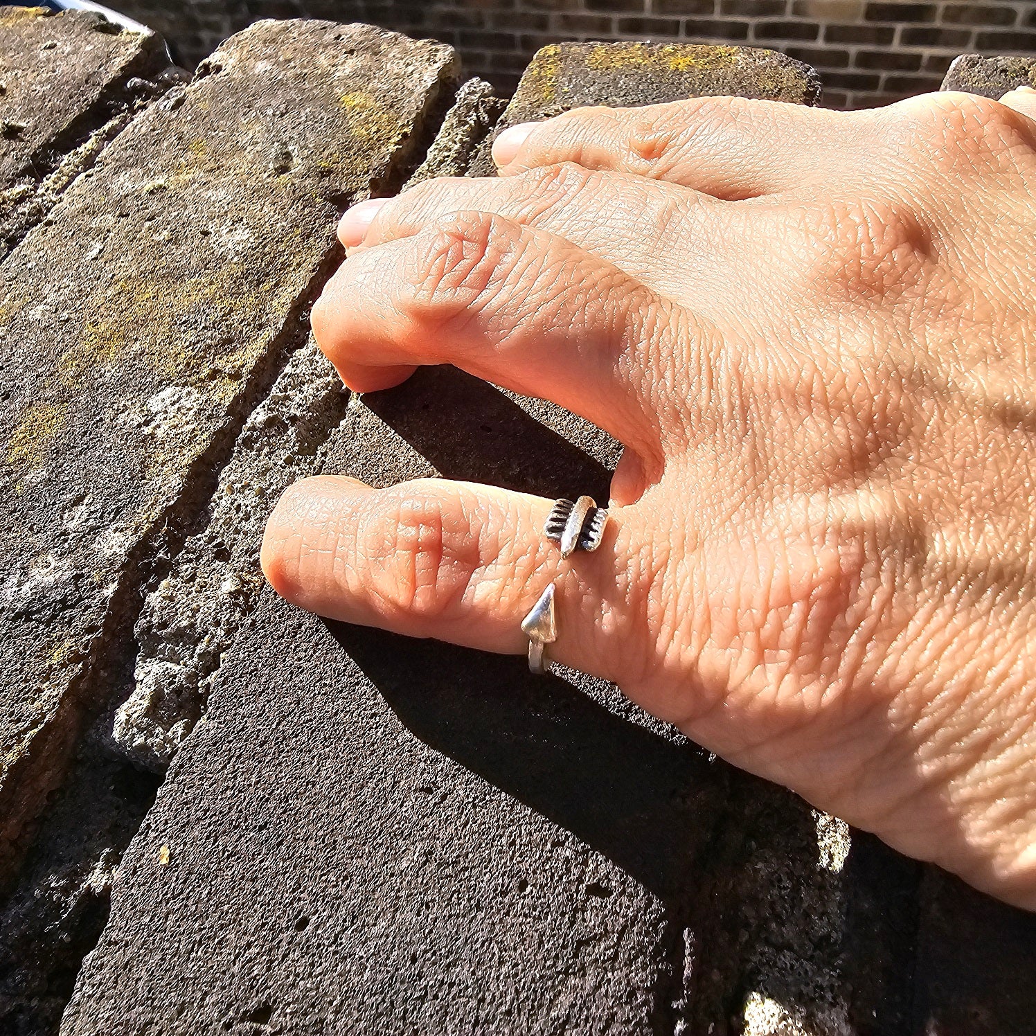 Modernist silver arrow ring, rectangular top symbol adjustable statement