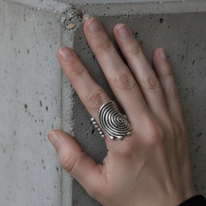 Spiral disc statement ring, sculptural silver concentric swirl design