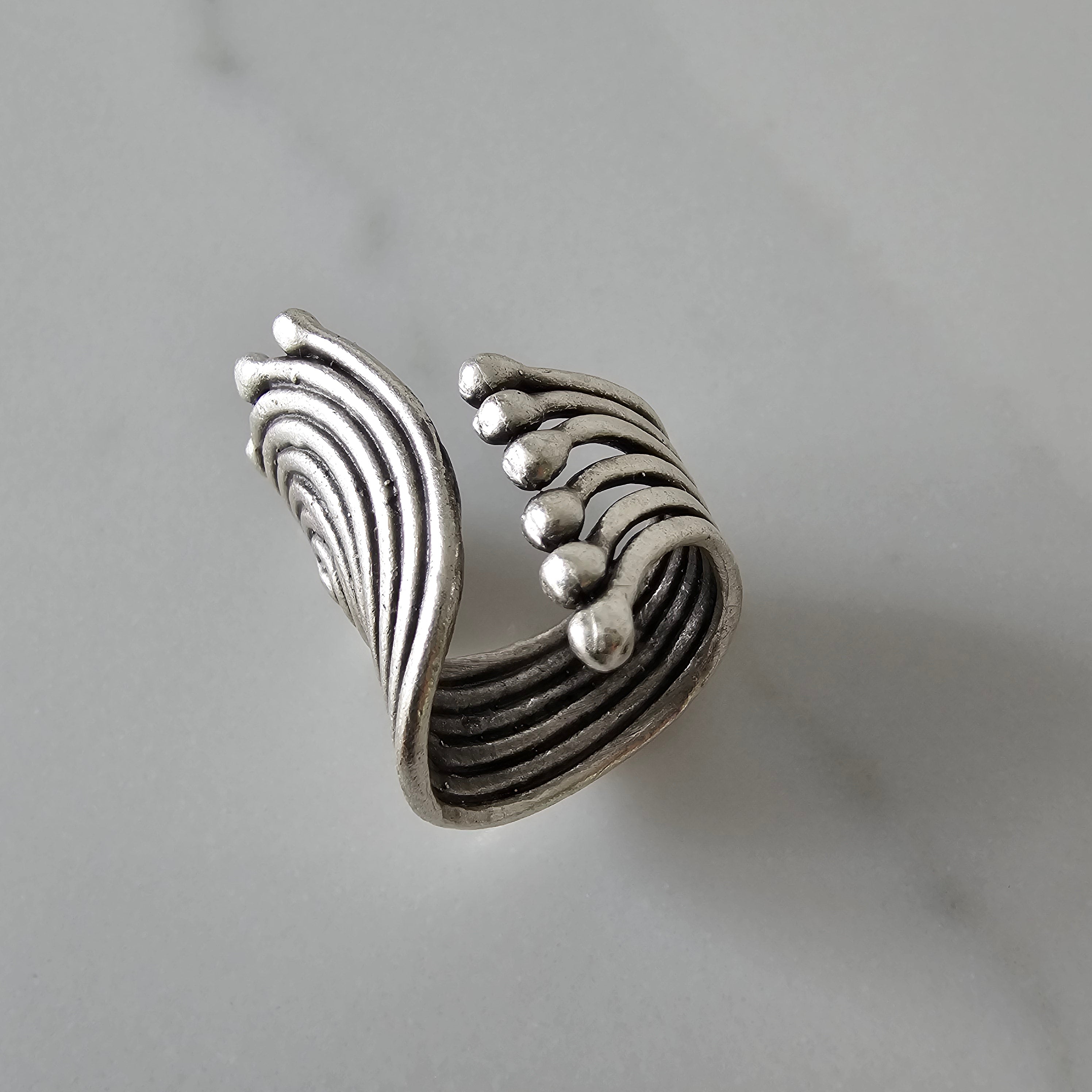 Spiral disc statement ring, sculptural silver concentric swirl design