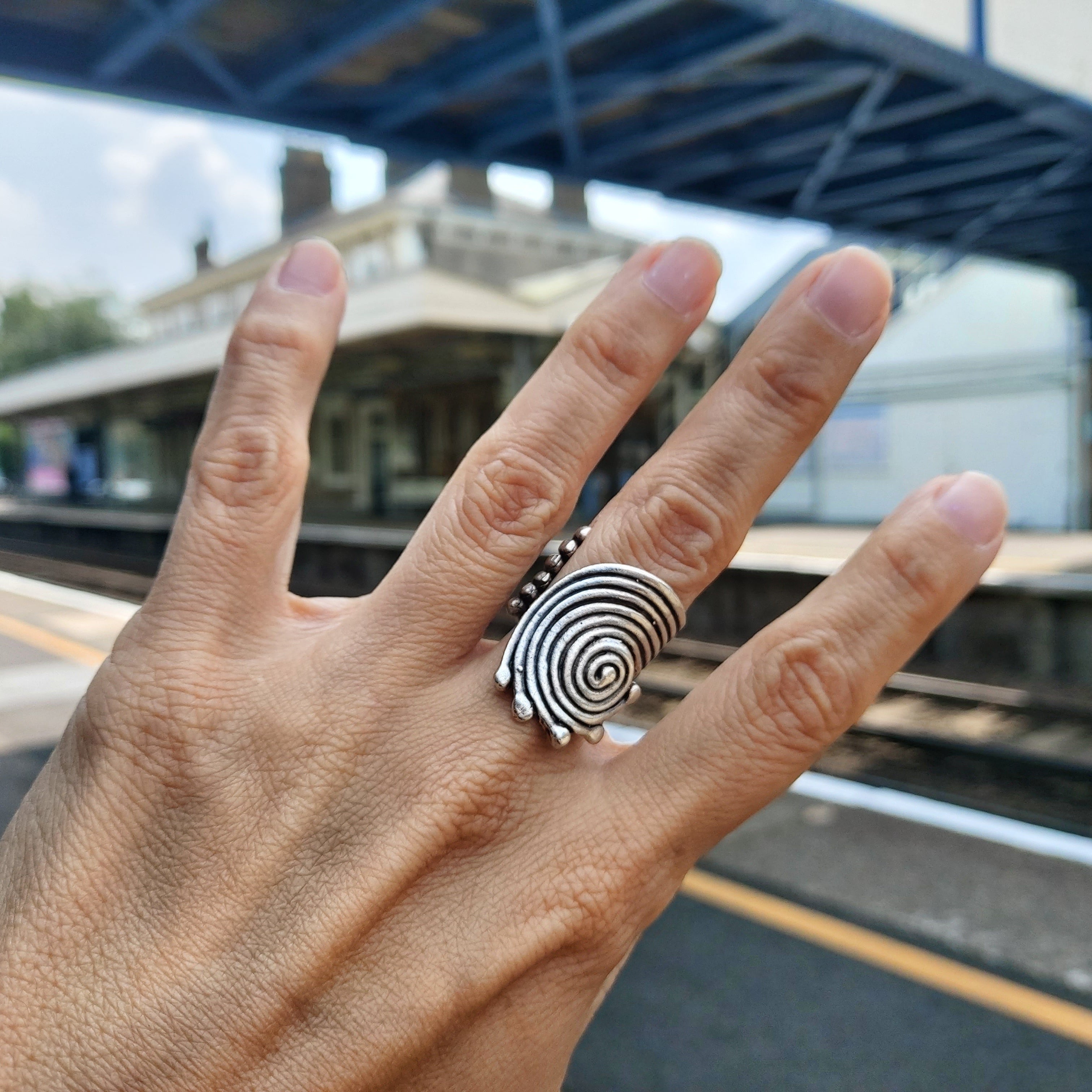 Spiral disc statement ring, sculptural silver concentric swirl design