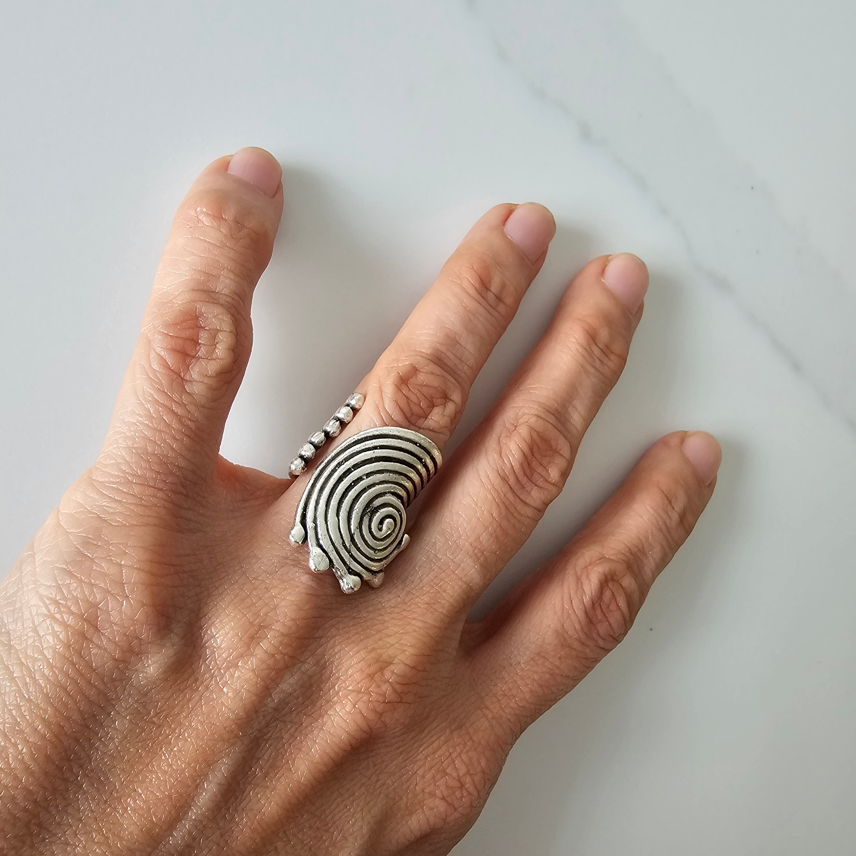 Spiral disc statement ring, sculptural silver concentric swirl design
