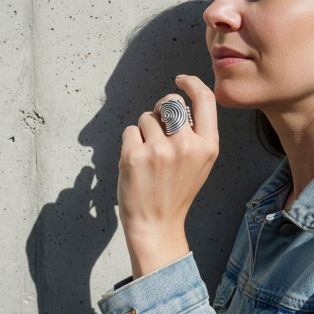 Spiral disc statement ring, sculptural silver concentric swirl design
